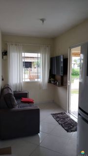 Casa à venda com um terreno de 1.226,78m² em Penha, com 01 casa contendo 02 dormitórios e garagem coberta para 3 carros. Ref 300