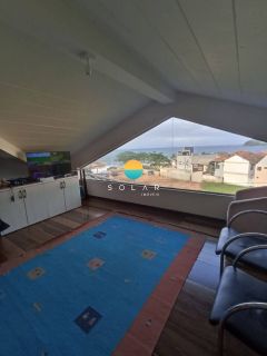 Casa à venda à aprox. 100m da Praia Grande com vista deslumbrante para o mar e loft com acesso individual! Ref. 401