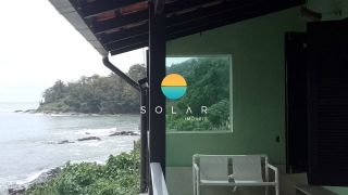 Casa à venda na Beira da Praia – Pé na areia com piscina e vista espetacular da praia de Armação - Penha/SC. Ref. 403