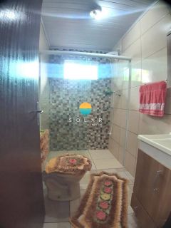 Casa à venda com piscina, com 03 dormitórios sendo 01 suíte, aprox. 1 km da praia de Armação em Penha/SC. Ref. 452