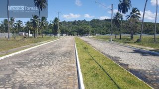Lote em condomínio à beira mar