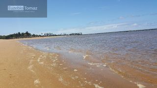 Lote em condomínio à beira mar