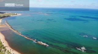 Lote em condomínio à beira mar