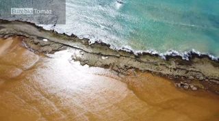 Lote em condomínio à beira mar