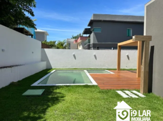 Luxo e Imponência no Alphaville: Casa com 4 Suítes, Pé Direito Duplo e Piscina