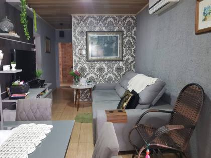 Casa com Edícula no Centro de Penha – Conforto e Exclusividade a 800m da Praia