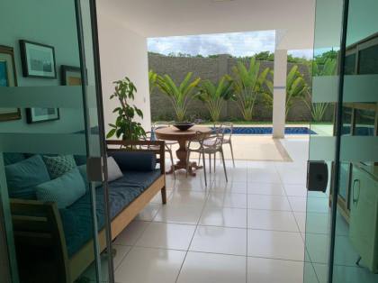 Casa de Condomínio Para Alugar com 4 quartos 4 suítes no bairro Alphaville II em Salvador