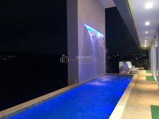 Casa à venda em Alphaville ll com 5 suítes e 8 vagas.